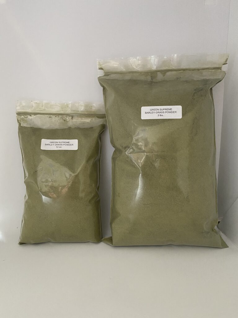 Two bags of green powder on display.