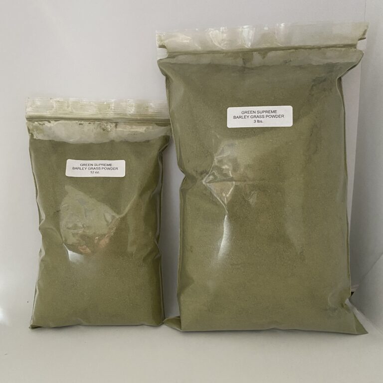 Two bags of green powder on display.